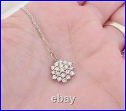 18ct gold 57 point cluster pendant on 9ct gold chain boxed