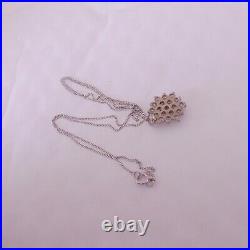 18ct gold 57 point cluster pendant on 9ct gold chain boxed