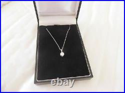 18ct gold diamond 1/2ct pendant on 9ct gold chain boxed