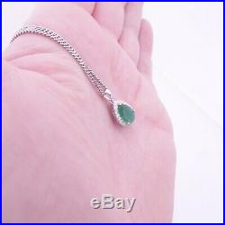 18ct gold emerald diamond pendant on 9ct gold chain