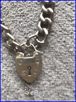 9ct Gold, Curb Chain Bracelet With Heart Padlock, 35.2 Grammes. Hallmarked