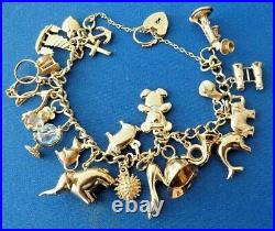 9ct Solid Hallmarked Gold Charm Bracelet 24 charms inc Padlock & chain 27.4 gm