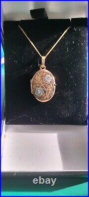 9ct yellow and white gold oval locket and chain with jeweller's gift box