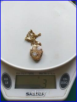 9ct yellow and white gold oval locket and chain with jeweller's gift box