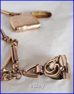 A Victorian 9ct gold double Albert watch chain, fob, T-bar & Vesta match case