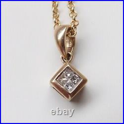 AN ELEGANT 9ct GOLD 12 POINT DIAMOND SET PENDANT WITH 20 INCH 9ct GOLD CHAIN